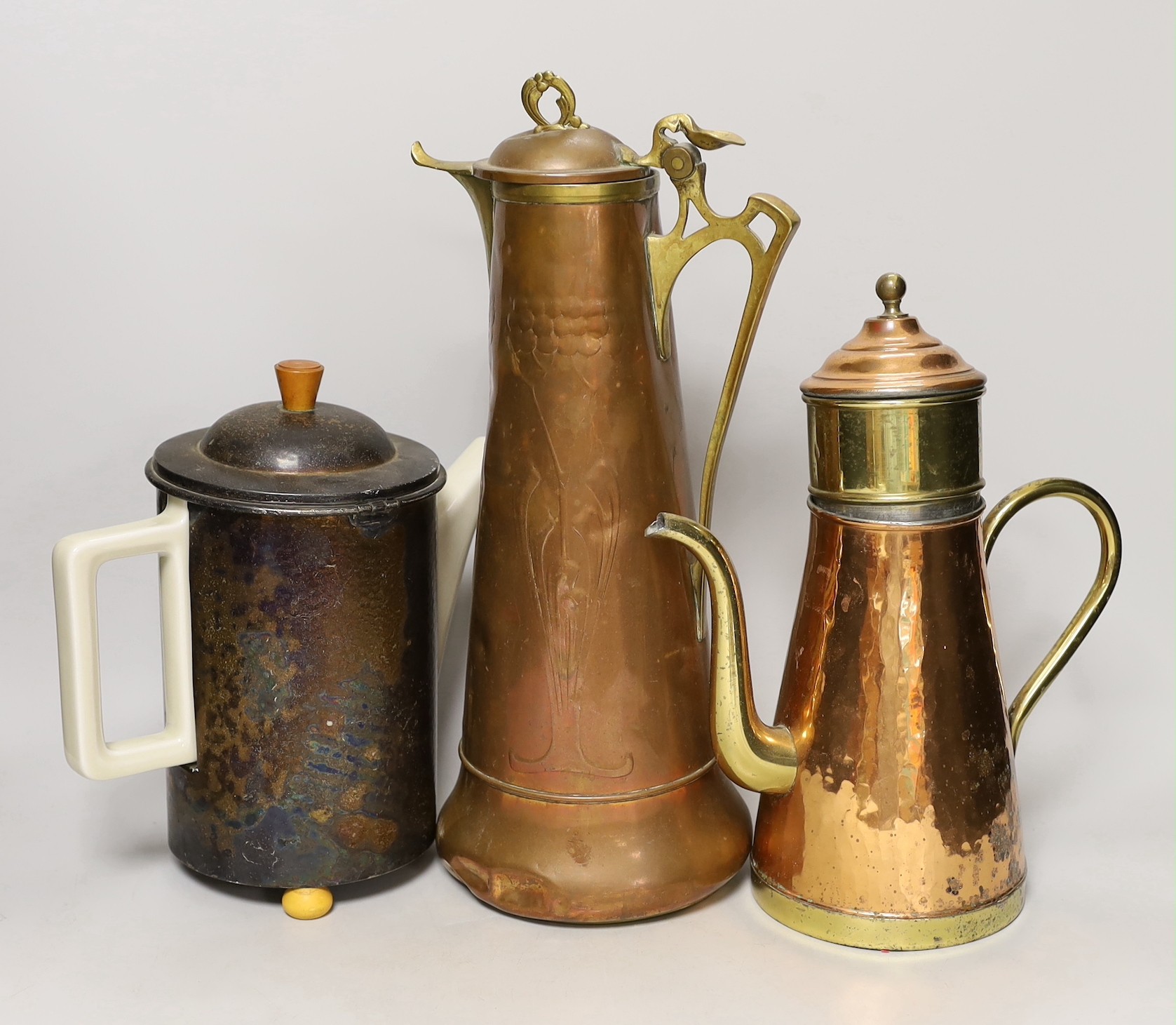 An Art Nouveau copper ewer, a WMF teapot and copper coffee pot, other metalware. Tallest 40cm